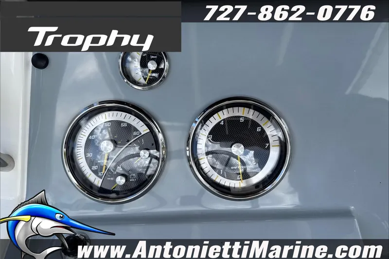 Slide: The Image of Dashboard of 2026 Trophy T22CC Center Console boat with gauges and branding. - 22