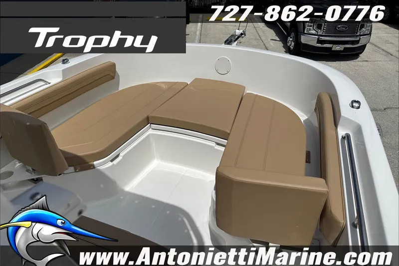 Slide: The Image of 2026 Trophy T22CC Center Console boat interior with tan seating, showcased by Antonietti Marine. - 26