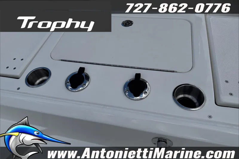 Slide: The Image of 2026 Trophy T22CC Center Console boat deck with cup holders and logo. - 34