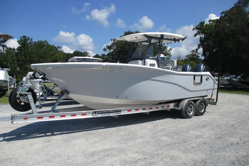 The Image of 2024 Sea Fox 268 Commander boat on trailer under clear blue sky. - 0