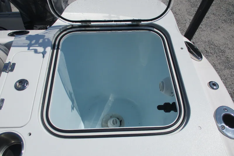 Slide: The Image of 2024 Sea Fox 268 Commander livewell, open lid, white interior, marine hardware. - 10