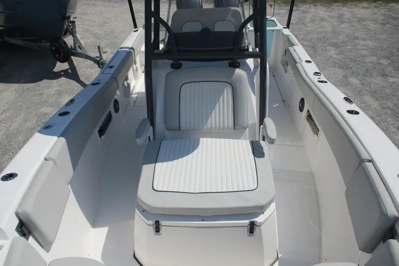 Slide: The Image of 2024 Sea Fox 268 Commander boat interior with cushioned seating and spacious deck. - 14