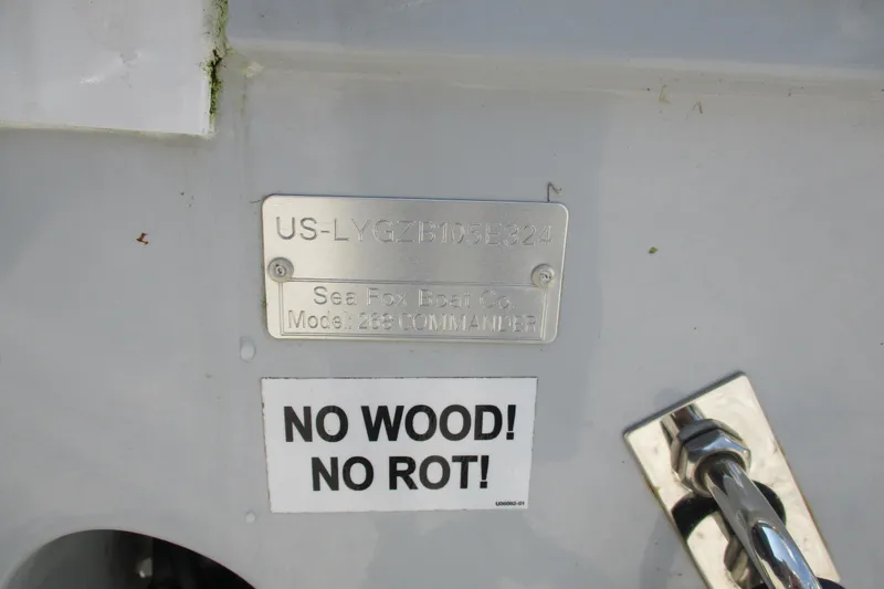 Slide: The Image of 2024 Sea Fox 268 Commander boat with "No Wood! No Rot!" label and identification plate. - 15