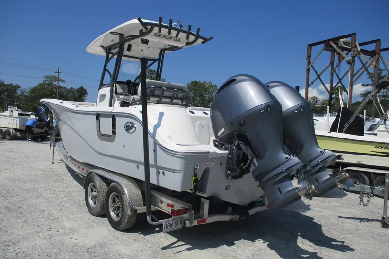 Slide: The Image of 2024 Sea Fox 268 Commander boat on trailer with dual outboard engines. - 3