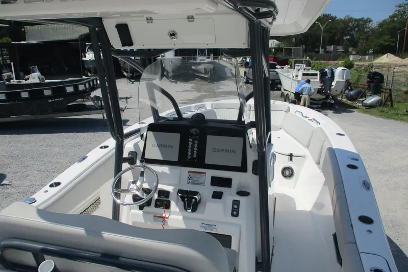 Slide: The Image of 2024 Sea Fox 268 Commander boat interior with Garmin navigation system and steering wheel. - 5