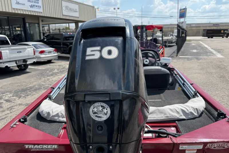 Slide: The Image of 2019 Tracker Pro 170 boat with 50 HP Mercury engine in a dealership lot. - 3