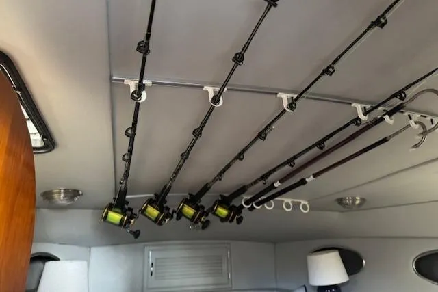 Slide: The Image of Fishing rods stored on ceiling of 1992 Mediterranean 38 Convertible boat interior. - 18