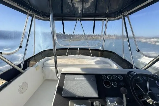 Slide: The Image of Control panel of a 1992 Mediterranean 38 Convertible boat, featuring gauges and levers. - 37