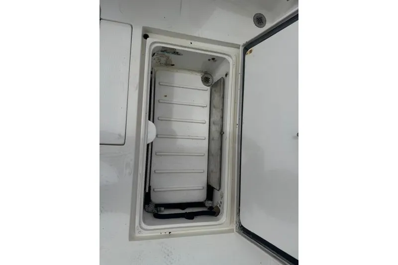 Slide: The Image of Open storage compartment on a 1992 Mediterranean 38 Convertible boat. - 46