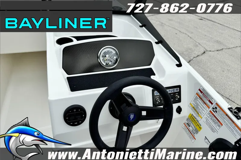 Slide: The Image of 2026 Bayliner Element E17 boat dashboard with steering wheel and controls. - 16