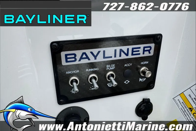 Slide: The Image of Control panel of 2026 Bayliner Element E17 boat with switches and branding. - 18