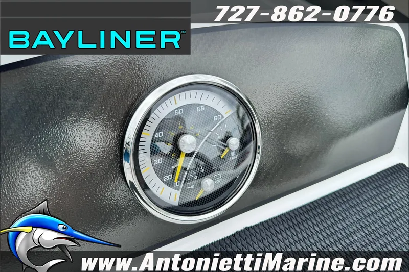 Slide: The Image of Dashboard of 2026 Bayliner Element E17 boat with speedometer and logo. - 19