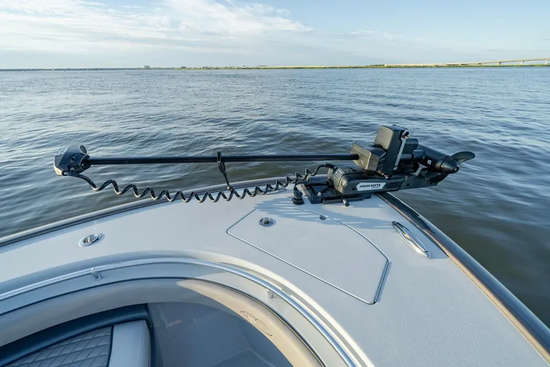 Slide: The Image of 2024 Valhalla Boatworks V-29 Hybrid with Minn Kota trolling motor on calm water. - 13