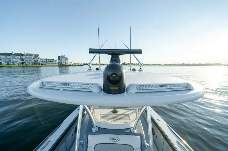 Slide: The Image of 2024 Valhalla Boatworks V-29 Hybrid on calm water, showcasing sleek design and advanced features. - 16