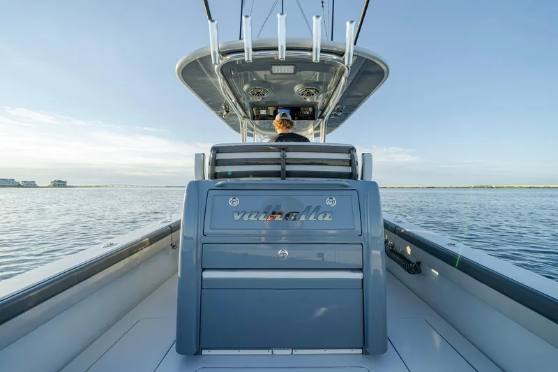 Slide: The Image of 2024 Valhalla Boatworks V-29 Hybrid on calm water, showcasing sleek design and modern features. - 27
