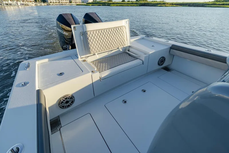 Slide: The Image of 2024 Valhalla Boatworks V-29 Hybrid interior with seating and dual Mercury engines. - 30