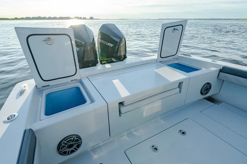 Slide: The Image of 2024 Valhalla Boatworks V-29 Hybrid with Mercury engines, open storage compartments, and sleek design. - 33