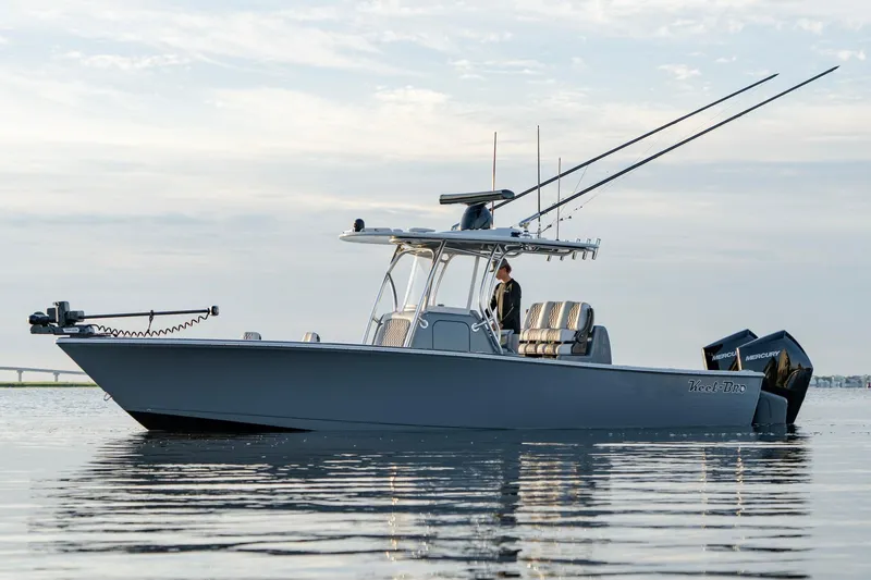 Slide: The Image of 2024 Valhalla Boatworks V-29 Hybrid on calm water, showcasing sleek design and advanced features. - 4