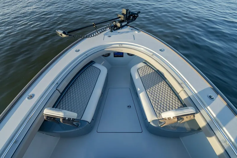 Slide: The Image of 2024 Valhalla Boatworks V-29 Hybrid bow seating area on calm water. - 9