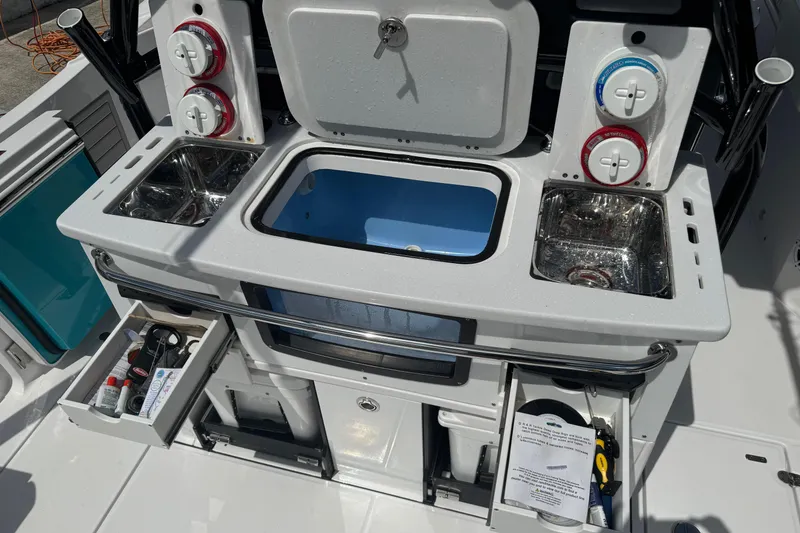 Slide: The Image of 2024 Blackfin 332 CC boat with fishing station, storage drawers, and sink. - 10