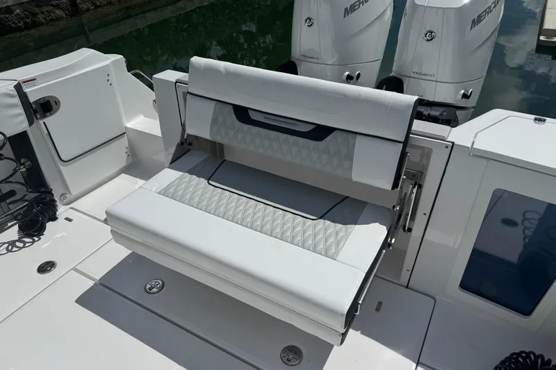 Slide: The Image of 2024 Blackfin 332 CC boat with foldable seating and dual Mercury engines. - 14