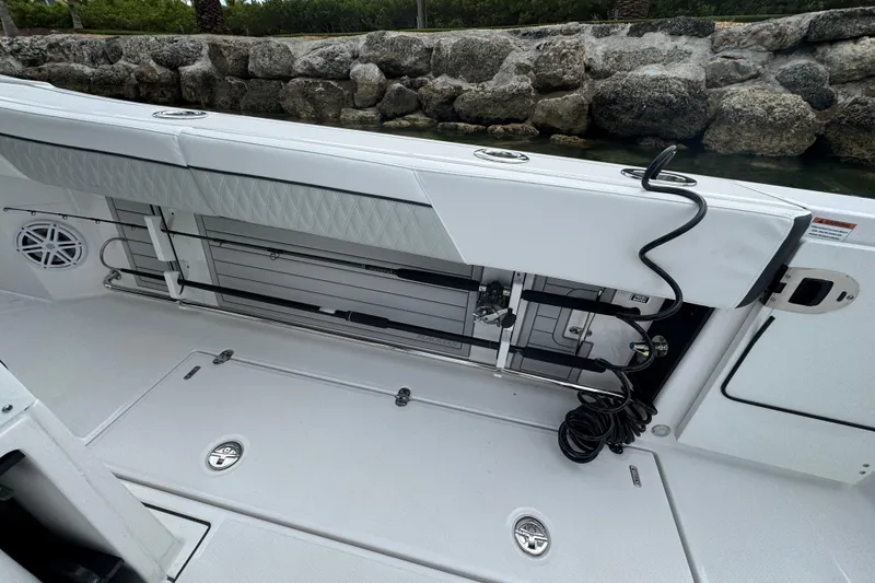 Slide: The Image of 2024 Blackfin 332 CC boat interior with storage and seating features. - 19