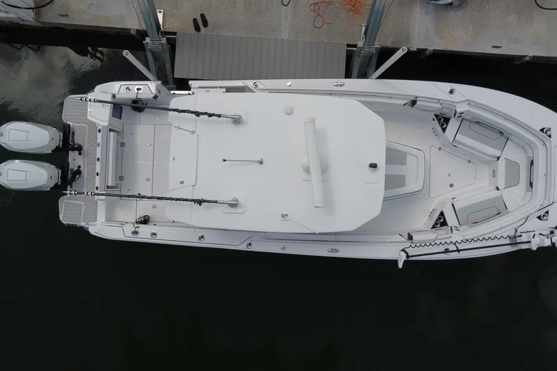 Slide: The Image of Overhead view of 2024 Blackfin 332 CC boat docked with dual engines. - 2