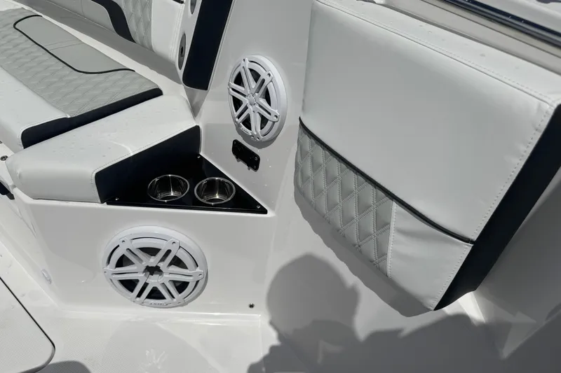 Slide: The Image of 2024 Blackfin 332 CC boat interior with speakers and cup holders. - 24