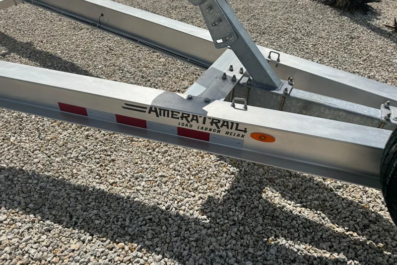 Slide: The Image of Trailer for 2024 Blackfin 332 CC boat on gravel surface. - 28