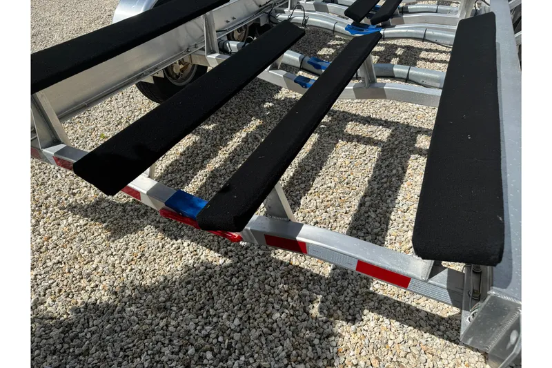 Slide: The Image of Boat trailer for 2024 Blackfin 332 CC on gravel surface. - 29