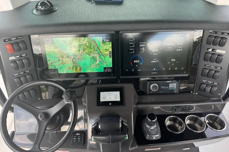 Slide: The Image of 2024 Blackfin 332 CC helm with advanced navigation and control systems. - 9