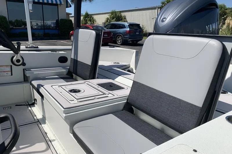 Slide: The Image of 2026 SeaArk Easy 200 boat interior with gray seating and Yamaha engine. - 11