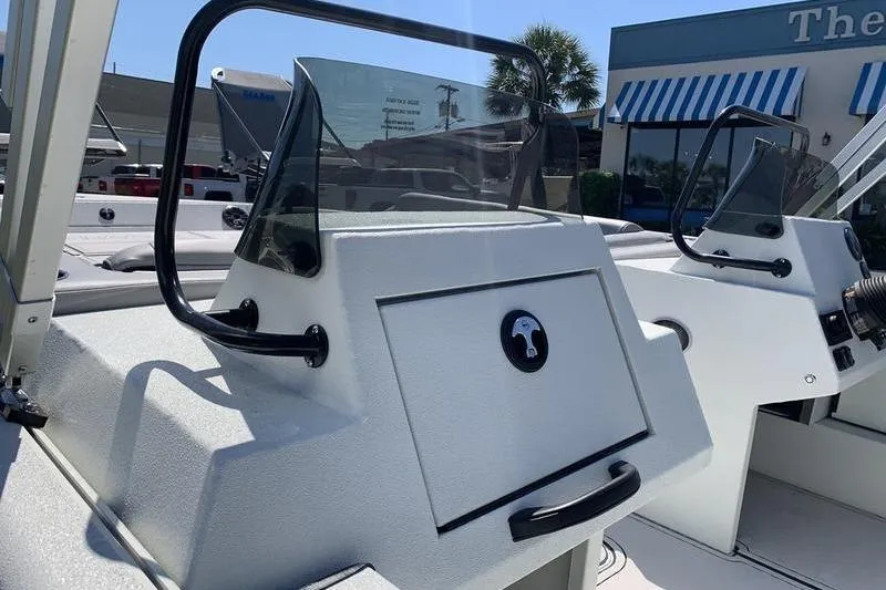 Slide: The Image of 2026 SeaArk Easy 200 boat console with windshield and storage compartment. - 12