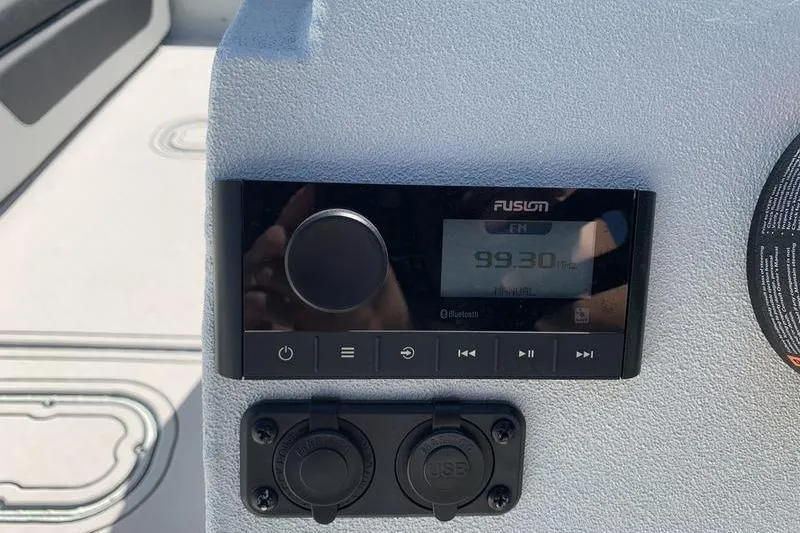 Slide: The Image of Fusion stereo system on 2026 SeaArk Easy 200 boat dashboard, displaying FM 99.30 MHz. - 17