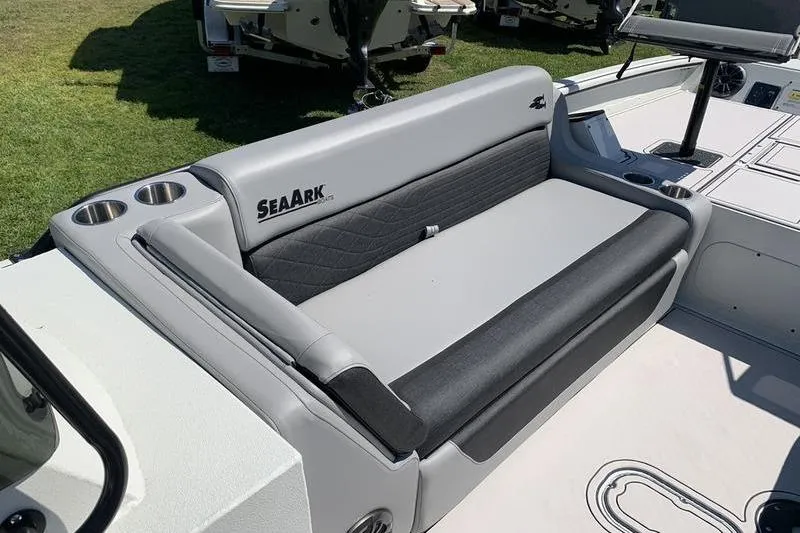 Slide: The Image of 2026 SeaArk Easy 200 boat interior with cushioned seating and cup holders. - 20