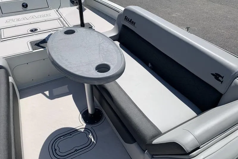 Slide: The Image of 2026 SeaArk Easy 200 boat interior with seating and oval table. - 23