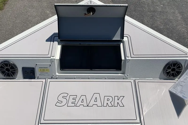 Slide: The Image of 2026 SeaArk Easy 200 boat deck with storage compartment and speakers. - 24