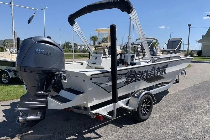 Slide: The Image of 2026 SeaArk Easy 200 boat with Yamaha engine on trailer, parked outdoors. - 4
