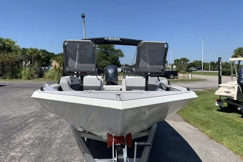 Slide: The Image of 2026 SeaArk Easy 200 boat on trailer, parked outdoors under clear blue sky. - 7