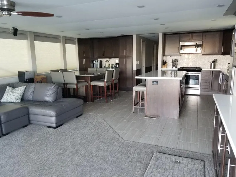 Slide: The Image of Luxurious interior of 2016 Bravada Epic Journey, featuring modern kitchen and spacious living area. - 12