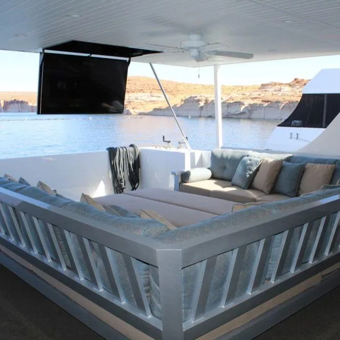 Slide: The Image of Luxurious Bravada houseboat interior with comfortable seating, scenic water view, and modern amenities. - 13