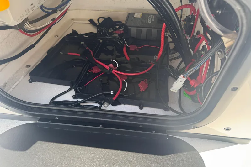 Slide: The Image of Electrical compartment of 2026 Blazer 675 Ultimate Bay with wiring and battery setup. - 14