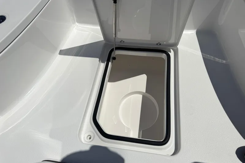 Slide: The Image of Open storage compartment on 2026 Blazer 675 Ultimate Bay boat deck. - 17