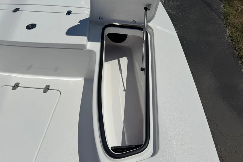 Slide: The Image of Open storage compartment on 2026 Blazer 675 Ultimate Bay boat deck. - 18
