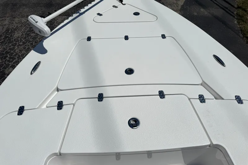 Slide: The Image of 2026 Blazer 675 Ultimate Bay boat deck with storage compartments and trolling motor. - 20