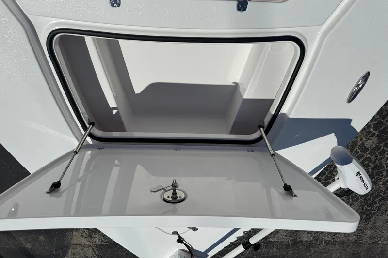 Slide: The Image of Open storage compartment on 2026 Blazer 675 Ultimate Bay boat. - 22