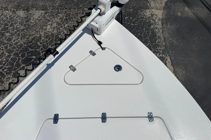 Slide: The Image of Bow of 2026 Blazer 675 Ultimate Bay boat with trolling motor and storage hatch. - 23