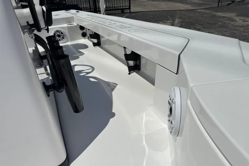 Slide: The Image of 2026 Blazer 675 Ultimate Bay boat interior with rod holders and speaker. - 29