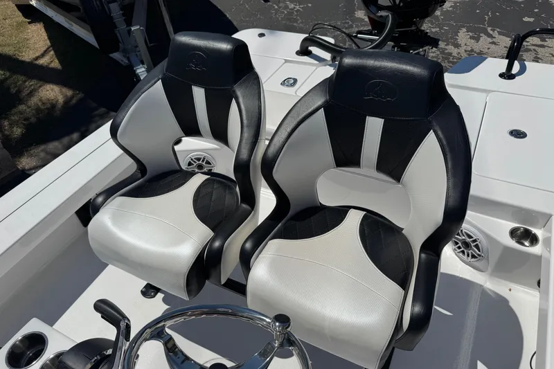Slide: The Image of 2026 Blazer 675 Ultimate Bay boat seats, black and white design, steering wheel visible. - 30