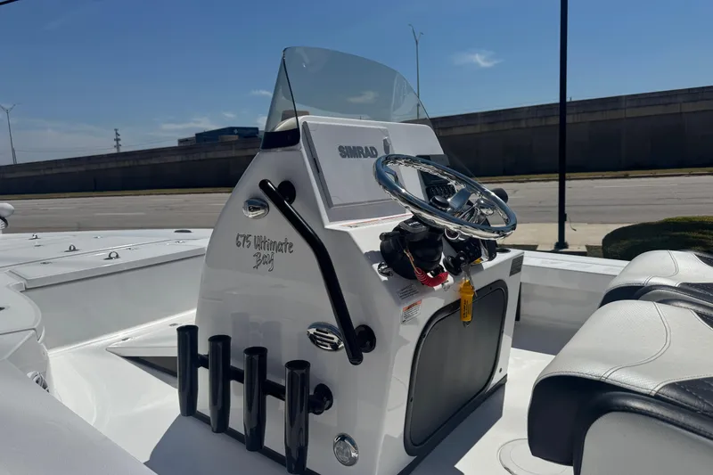 Slide: The Image of 2026 Blazer 675 Ultimate Bay boat console with steering wheel and seating. - 8